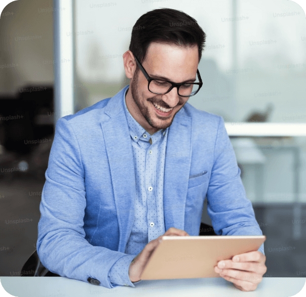 smiling-business-man-using-ipad - Focal Point