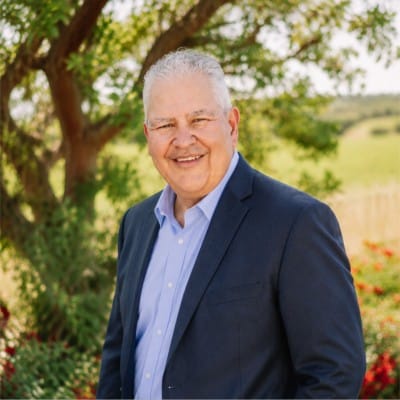 Professional headshot of Lalo Solorzano of Simply Trade Podcast